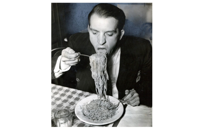 Phillip J. Stazzone is on WPA and Enjoys His Favorite Food as He’s Heard That the Army Doesn’t Go in Very Strong for Serving Spaghetti, 1940, Weegee.