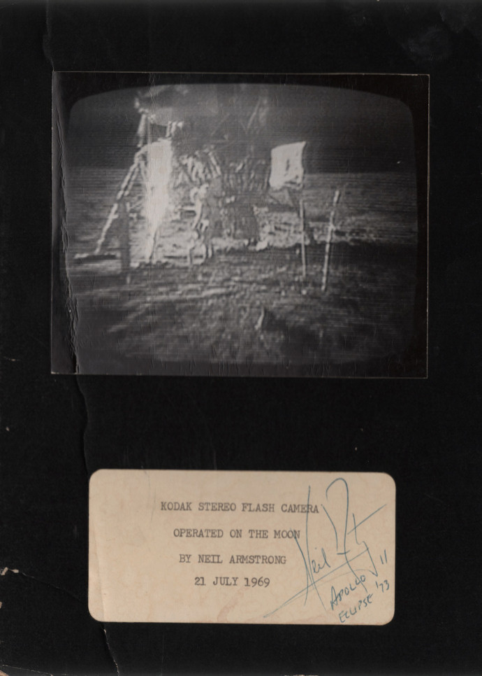 NASA Photographer’s, Kodak Stereo Flash Camera Operated on the Moon by Neil Armstrong, 1969, vintage silver gelatin print on glossy fibre paper mounted on original board, printed in 1969, in blue pen: signature of Neil Armstrong, Apollo 11 Eclipse ´73, 10,1 (22,9) x 12,5 (17,9) cm, ©NASA.Daniel Blau