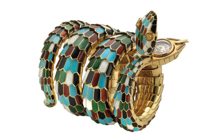 Bracelet-montre Serpenti en or, émail polychromé et diamant jaune (ca. 1967).