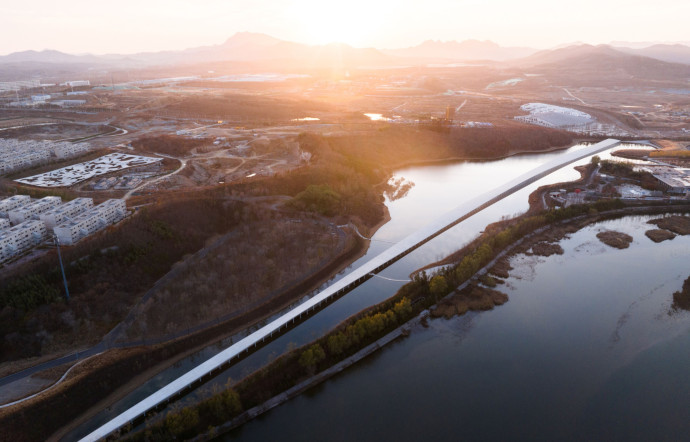 À Rizhao, le projet a démarré par un appel de Xu Qunde, président de la Shandong Bailuwan Company, promoteur œuvrant activement dans la région.